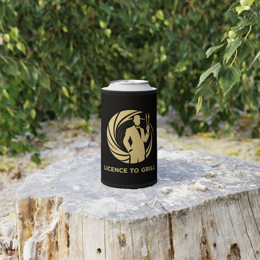 Black can cooler with 'Licence to Grill' design on a wooden stump outdoors.